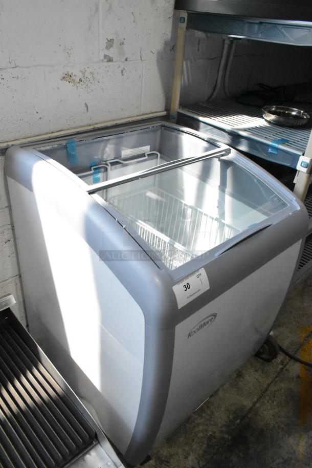 KoolMore MCF-6C 26 in. display ice cream freezer with commercial casters. Note: broken glass sliding door. Model: MCF-6C.
