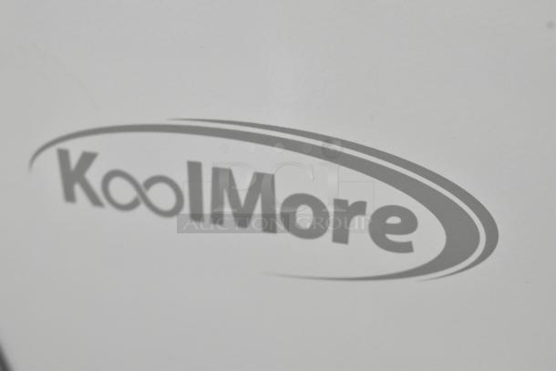 KoolMore MCF-6C logo on white surface. Commercial ice cream freezer, new with scratch and dent condition.