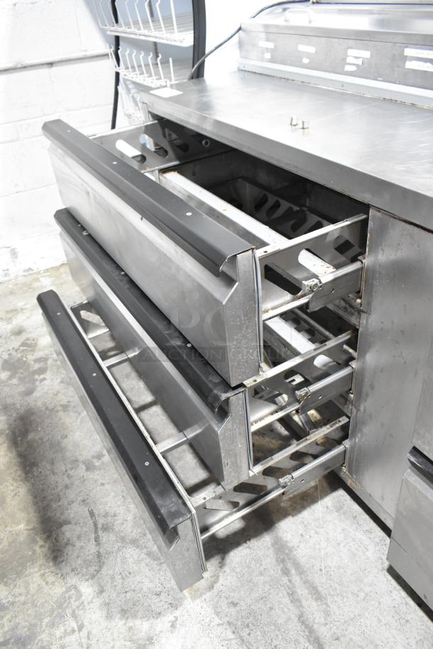 Silver King SKPZ72D stainless steel pizza prep table with 5 drawers, 115 volts, 1 phase. Commercial-grade, used condition.