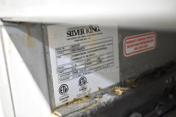 Silver King SKPZ72D label showing model, serial, voltage, Hertz, and refrigerant details for commercial pizza prep table.