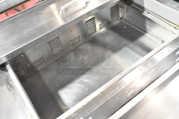 Silver King SKPZ72D stainless steel pizza prep table drawer interior, shows light wear. Commercial use.
