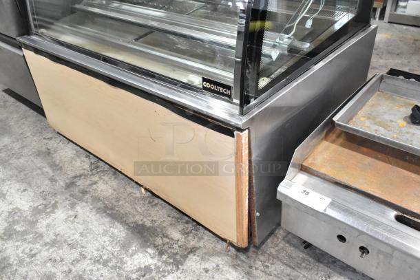 Cooltech Metal Commercial Refrigerated Display Case with broken side pane. Floor style, 120 volts, 1 phase.