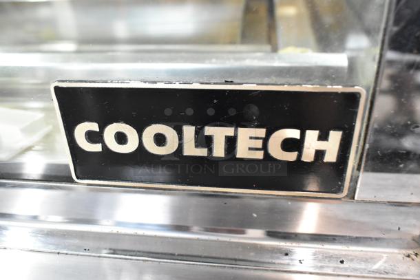 Cooltech metal refrigerated display case with glass side pane damage. 120 volts, 1 phase. Brand tag visible.