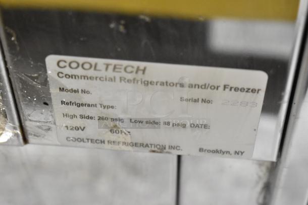 Cooltech refrigerated display case, commercial floor style, 120V, 1 phase. Broken glass on side pane. Serial No: 2289.