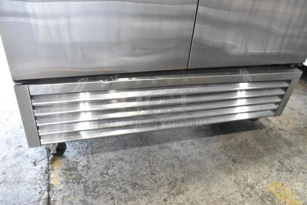 True T-49F stainless steel commercial freezer with two doors, poly coated racks, on casters. 115V, 1 Phase.