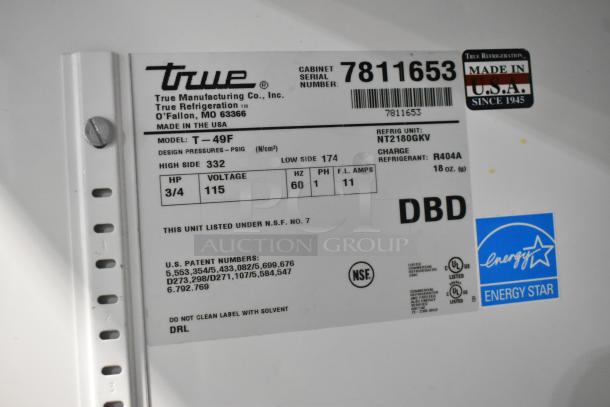 True T-49F stainless steel commercial freezer label, showing model, voltage, refrigerant type, and NSF certification.