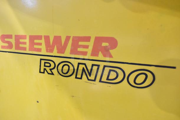 Seewer Rondo SS063C commercial dough sheeter, yellow body, reversible, floor style, 250 volts, visible brand name.