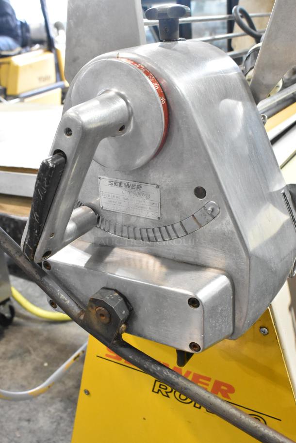 Seewer Rondo SS063C reversible dough sheeter, metal build, 250 volts. Features adjustable thickness handle and manufacturer's label.