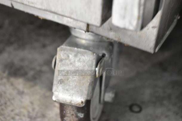 Leader ESLM60S/C stainless steel prep table caster, showing commercial-grade construction and mobility feature.