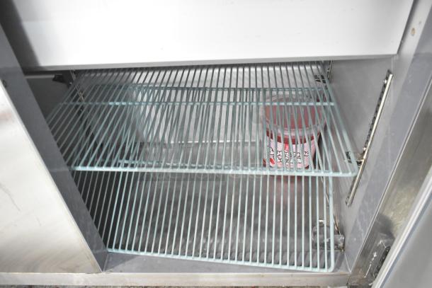 Leader ESLM60S/C stainless steel commercial prep table, with casters, interior shelving, 115 volts, 1 phase. Good condition.