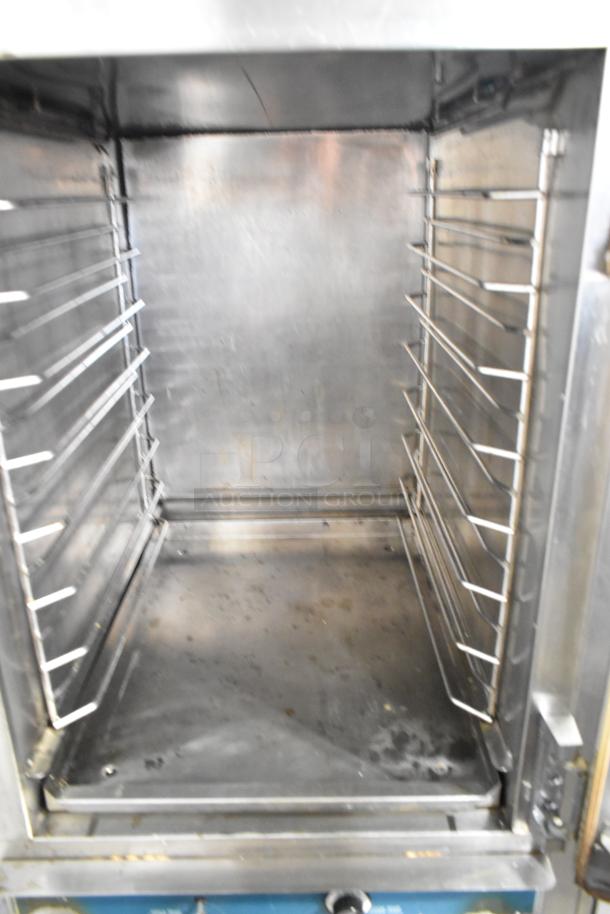Alto Shaam 1000-TH-I Halo Heat stainless steel commercial cook and hold oven interior, on commercial casters.