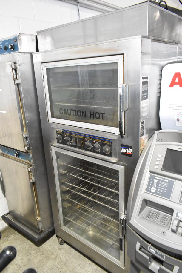 Nu Vu SUB-123 stainless steel commercial oven proofer on casters, 208V, 3-phase, with control dials and "Caution Hot" label.