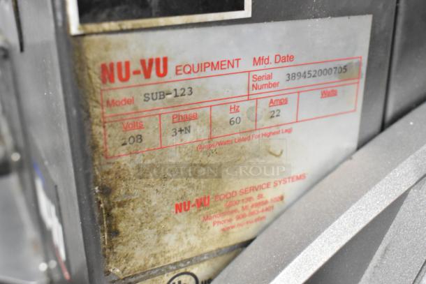Nu Vu SUB-123 stainless steel commercial oven proofer, 208V, 3 phase, on casters. Visible serial number and voltage details.