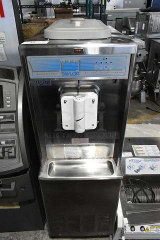 Taylor 441-27 Stainless Steel Commercial Floor Style Water Cooled Single Flavor Soft Serve Ice Cream Machine on Commercial Casters. 208-230 Volts, 1 Phase. - Item #1201107