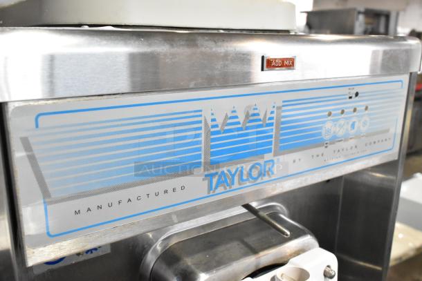 Taylor 441-27 stainless steel soft serve ice cream machine with "Add Mix" label, single flavor, water-cooled, on casters.
