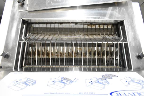 Oliver 732-N metal commercial bread loaf slicer, stainless steel, visible wear, 115 volts, 1 phase, countertop model.