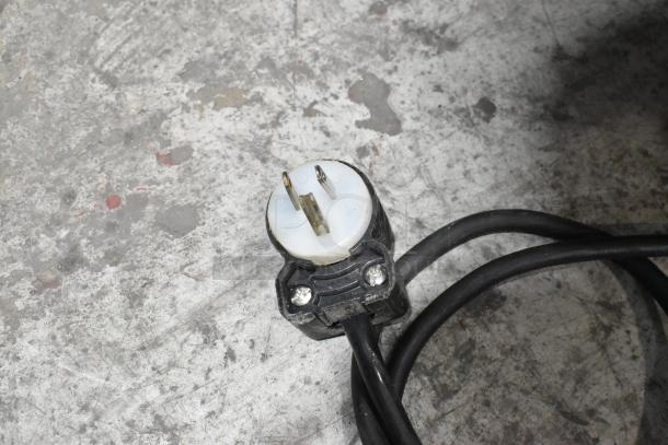 Oliver 732-N metal bread loaf slicer power plug on concrete surface, 115 volts, 1 phase.