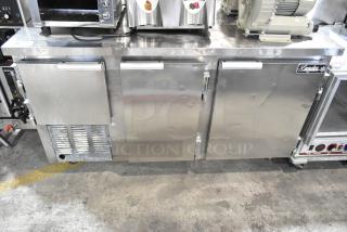 Leader LB60 S/C stainless steel 3-door undercounter cooler, commercial casters, 115V, minor dents, visible logo.