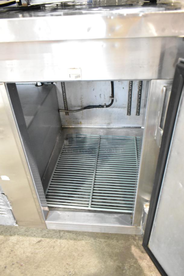 Leader LB60 S/C stainless steel 3-door undercounter cooler on casters. Interior view, commercial use, 115 volts, 1 phase.