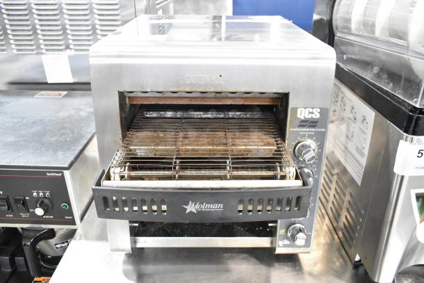 Star Holman QCS-2-80C conveyor toaster oven in stainless steel, used, 208 volts, 1 phase, caution marking visible.
