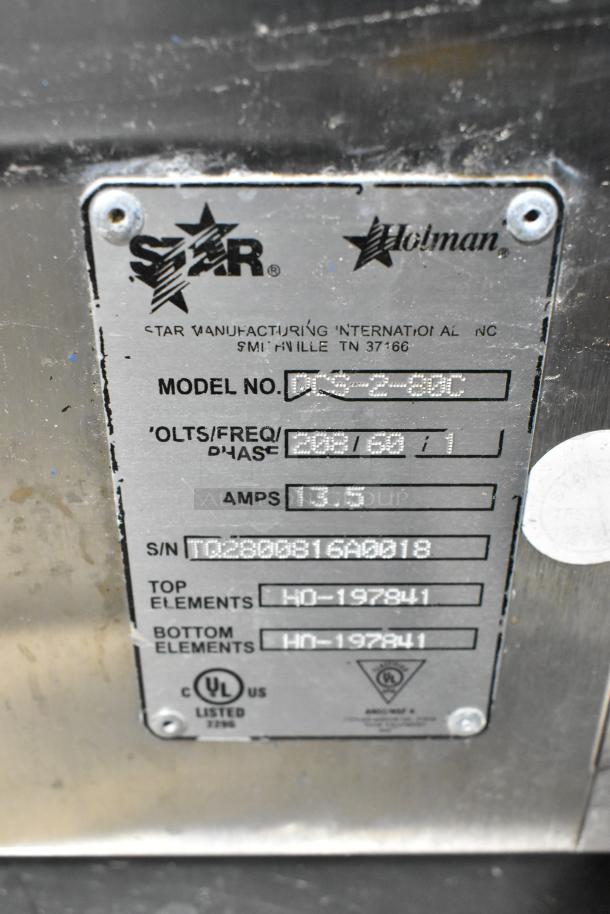 Star Holman QCS-2-80C stainless steel commercial toaster oven label, 208V, 1 phase, model details and serial number visible.