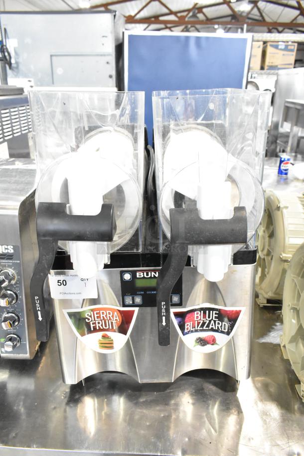 Bunn ULTRA-2 stainless steel commercial double hopper slushie machine, model ULTRA-2. No lids. Sierra Fruit, Blue Blizzard labels.