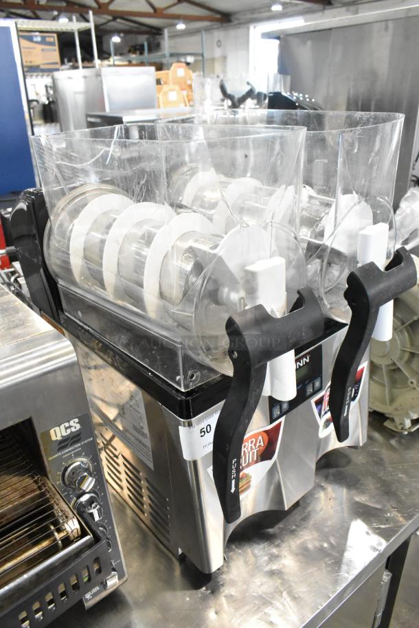 Bunn ULTRA-2 slushie machine, double hopper, stainless steel, no lids, visible controls, good condition, auction label attached.
