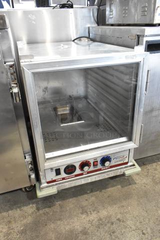Winholt Metal Commercial Heater Proofer Cabinet in used condition, featuring digital controls, on commercial casters.