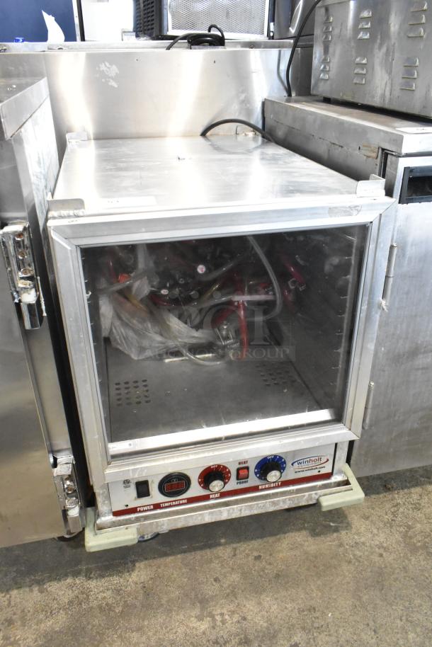 Winholt metal commercial heater proofer cabinet, features control panel for temperature and humidity, on casters, used condition.
