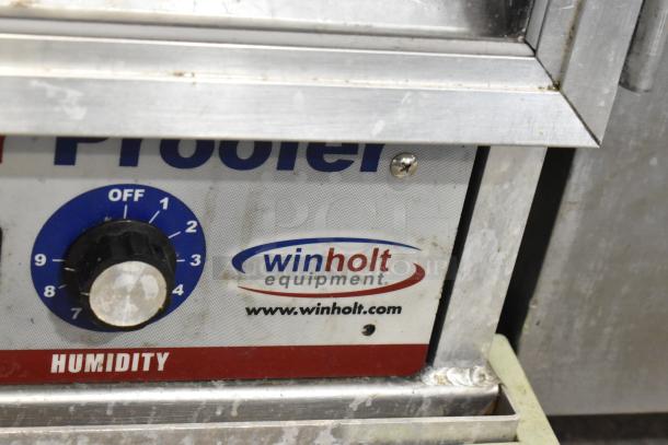 Winholt metal commercial heater proofer cabinet with humidity control knob, showing wear. Logo and website visible.