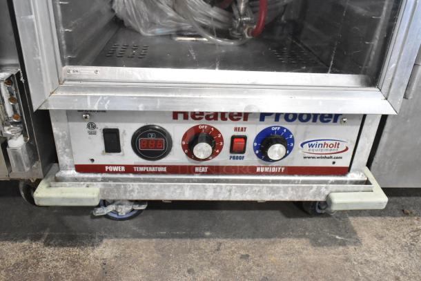 Winholt metal commercial heater proofer cabinet on casters, with temperature, heat, and humidity controls. Used condition.