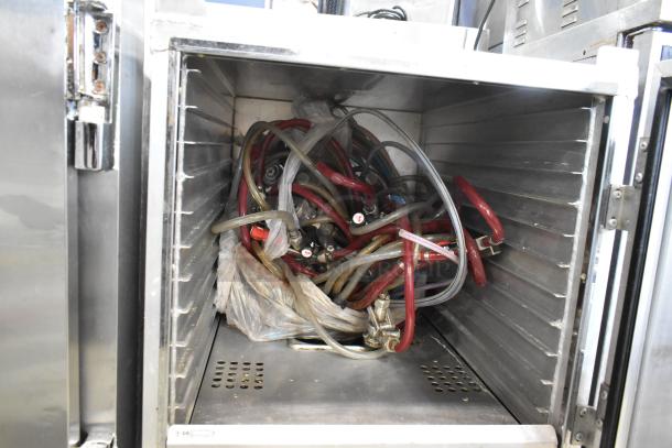 Winholt metal commercial heater proofer cabinet on casters, interior with coiled tubing, used condition.