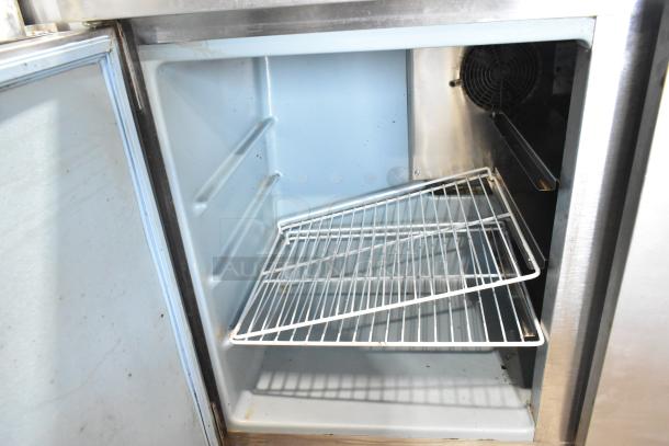 Delfield UC4048 stainless steel undercounter cooler, two doors, commercial casters, 115V, 1 phase, open interior view.
