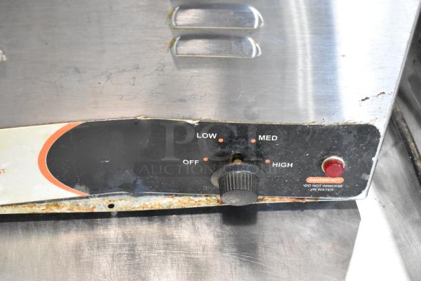 Nemco 6055A stainless steel commercial countertop food warmer with adjustable temperature dial and caution label. Used condition.