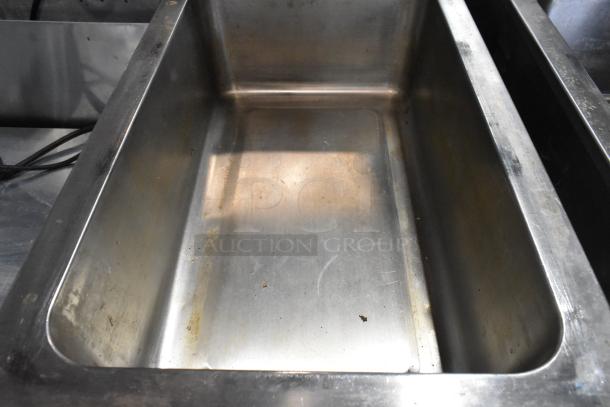 Nemco 6055A stainless steel commercial food warmer, 120 volts, slightly used, visible wear on interior surface.