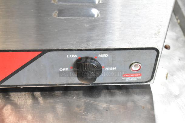 Nemco 6055A stainless steel food warmer with temperature dial and caution label visible. 120 volts, 1 phase.