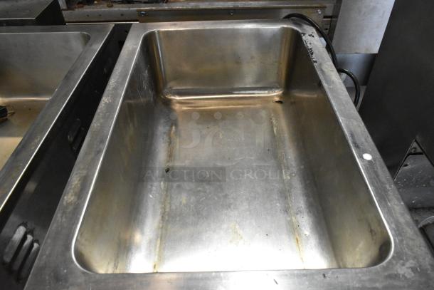 Nemco 6055A stainless steel commercial countertop food warmer, showing interior condition, 120 volts, 1 phase.