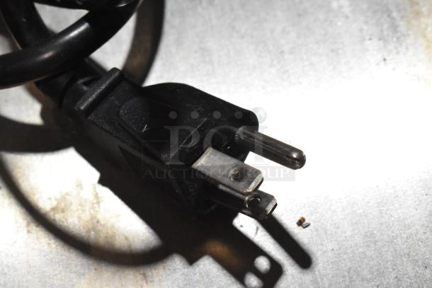 Close-up of a power plug for the Nemco 6055A countertop food warmer, emphasizing electrical compatibility and condition.