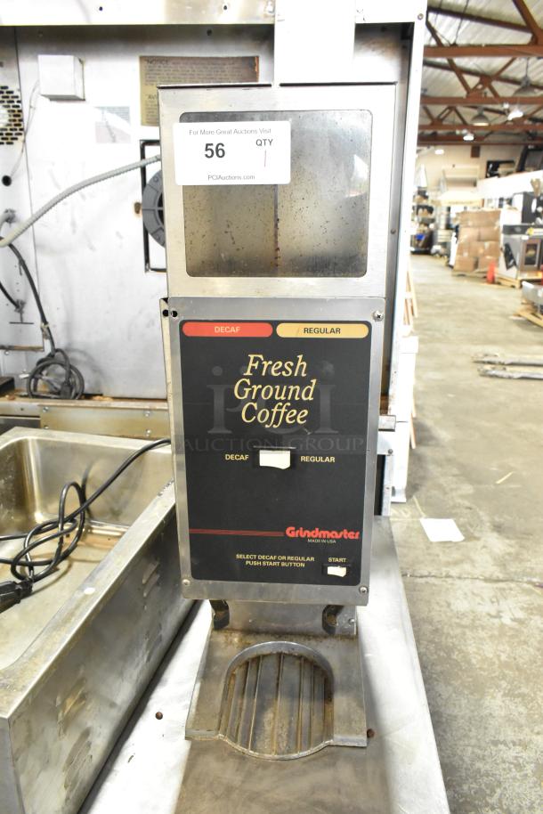 Metal commercial countertop coffee bean grinder by Grindmaster. Features decaf and regular settings, 120 volts, 1 phase.