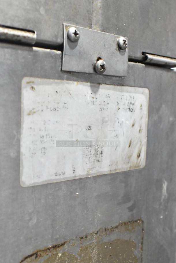 Metal commercial countertop coffee grinder, 120 volts, 1 phase, visible wear, label details faded.