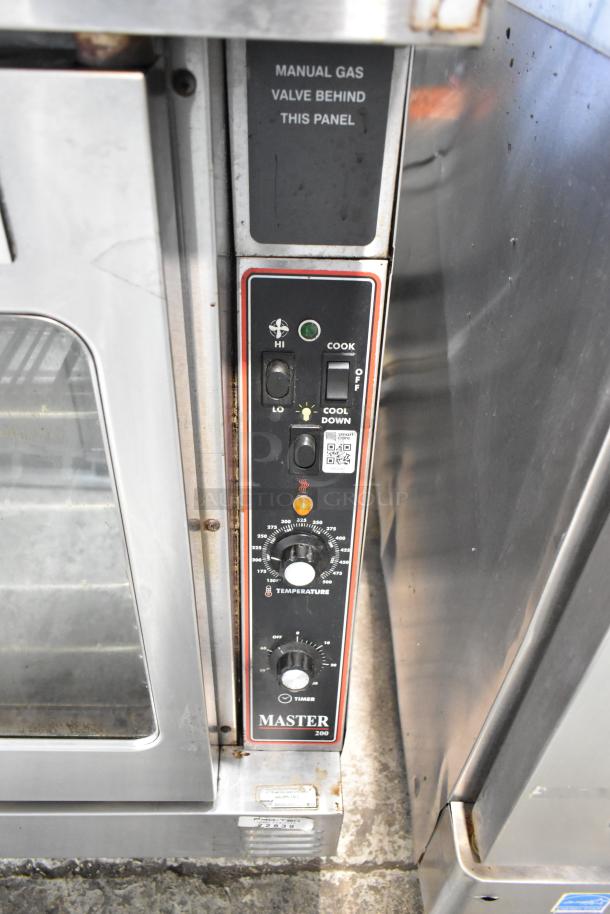 Garland Master 200 stainless steel convection oven with view doors, metal racks, thermostatic controls, and manual gas valve.
