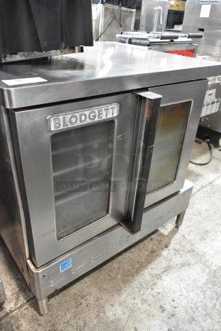 Blodgett stainless steel full-size convection oven with view-through doors, metal racks, and thermostatic controls.