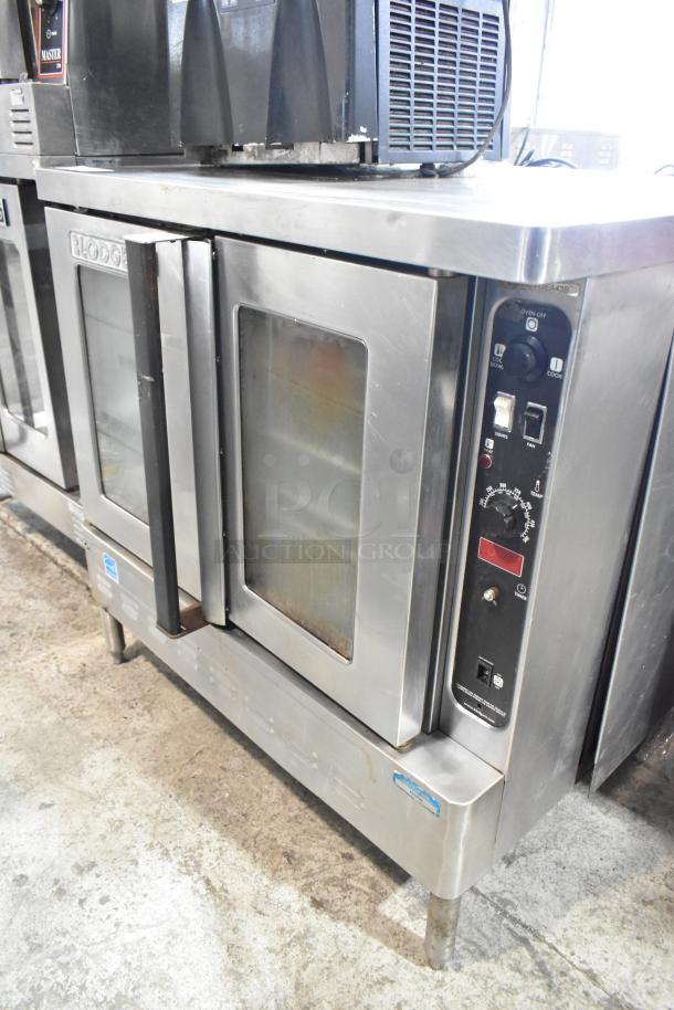 Blodgett stainless steel convection oven with view through doors, metal racks, and thermostatic controls, commercial grade.