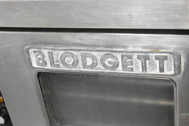 Blodgett stainless steel convection oven with view-through doors, metal racks, and thermostatic controls. Brand logo visible.