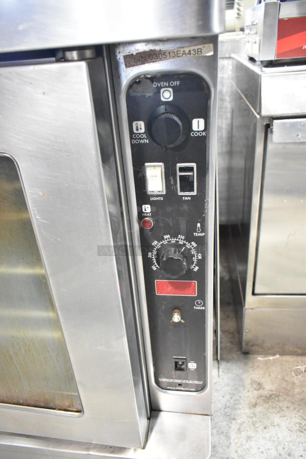 Blodgett stainless steel commercial full-size convection oven, features view-through doors, metal racks, thermostatic controls.