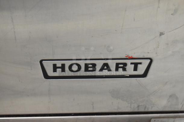 Hobart LX18H stainless steel commercial undercounter dishwasher, 120/208V, 1 Phase, visible wear marks, Hobart logo displayed.