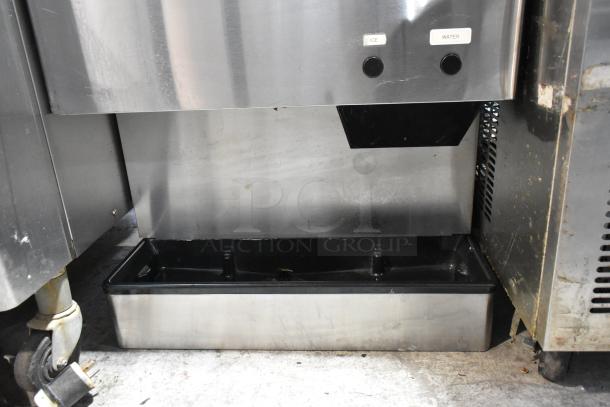 Hoshizaki DCM-500BAH stainless steel countertop water and ice dispenser, 618 lb capacity, 40 lb storage, visible use marks.