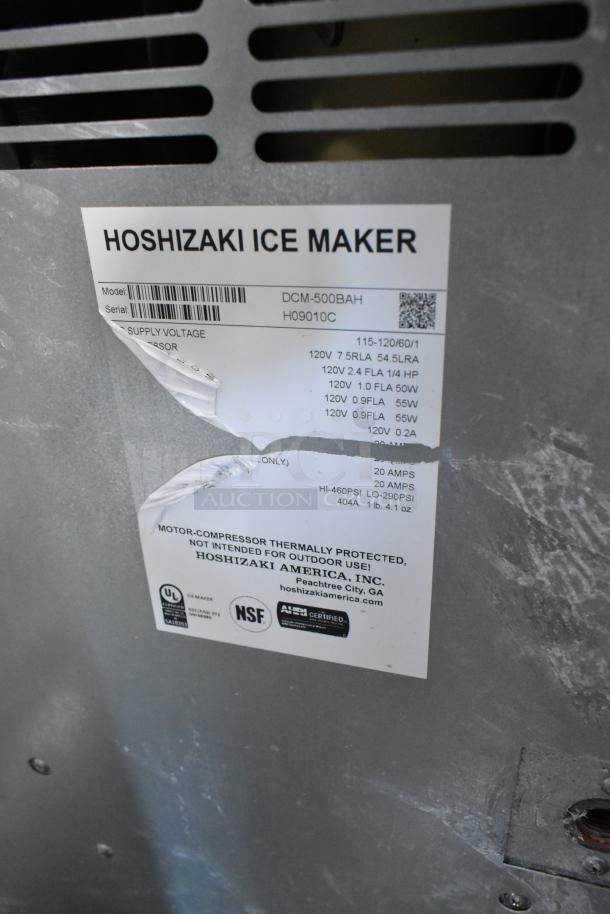 Hoshizaki DCM-500BAH stainless steel ice and water dispenser label. Model and serial details visible.