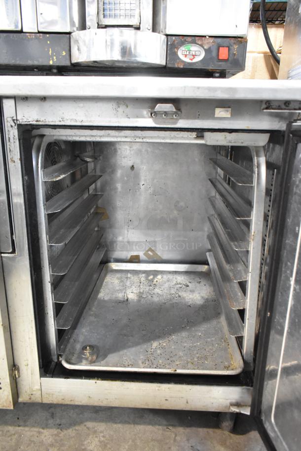 Everest ETF1 stainless steel undercounter freezer, single door, commercial casters, used condition, 115V, 1 phase.