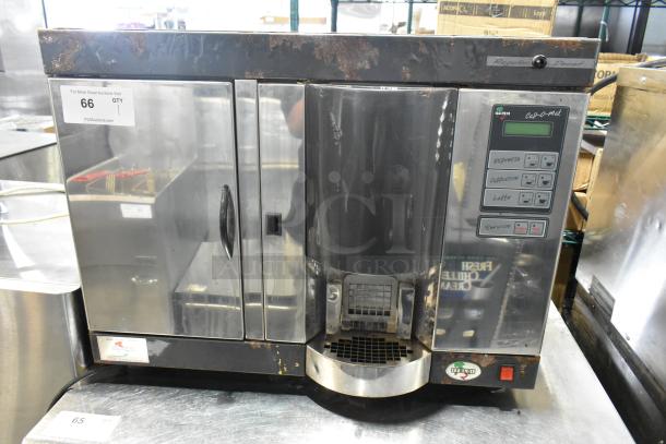 Italgi Cap-o-mat Superautomatic espresso machine, metal body, countertop model, visible wear, 110V, 1 phase, with control panel.